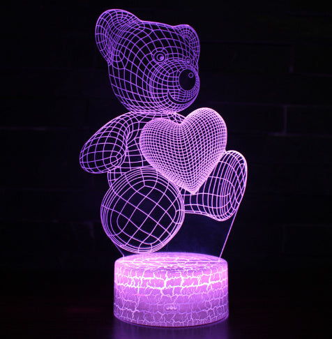 
3D Teddy Bear LED Night Light with 16 color options, touch and remote control, made from acrylic material. Powered by USB or batteries, perfect for kids' room decor.