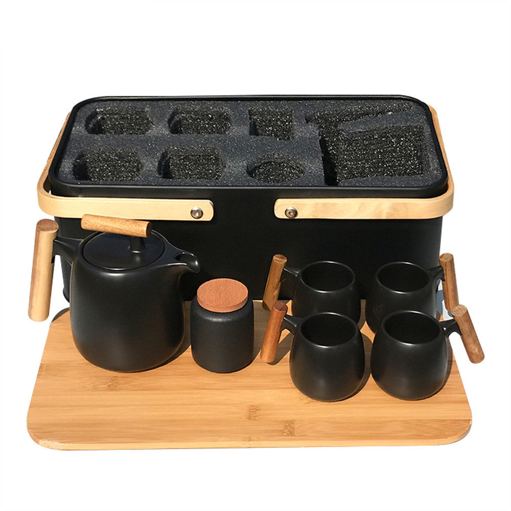 Elegant black porcelain pastoral style portable tea set, featuring an 8-piece set with a small and fresh design, perfect for outdoor tea experiences.