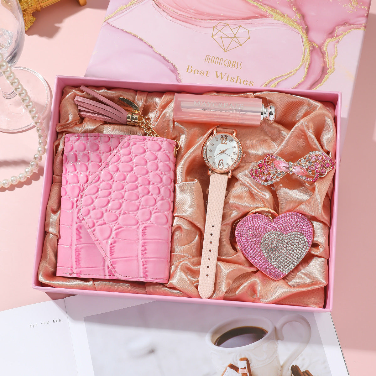 **Ladies Pink Watch Gift Set – Elegant & Functional 💖** A stylish **quartz movement** watch with **chronograph** function and **pointer display**. Available in **square belt**, **round belt**, and **square rubber** designs, featuring a **35mm dial** and **screw crown**. Includes a **wallet**, **vanity mirror**, **key chain**, and **brooch**—the perfect gift set for any occasion. 🎁
