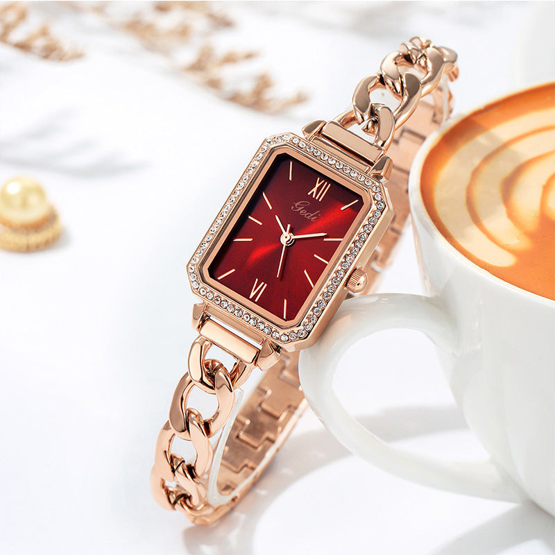 Luxury ladies watch featuring a sleek square dial with a choice of red, gold plate, starry sky black, or small green color options. The 8mm thick watch boasts a mineral reinforced glass mirror, a jewelry buckle, and a stainless steel back for durability and style.