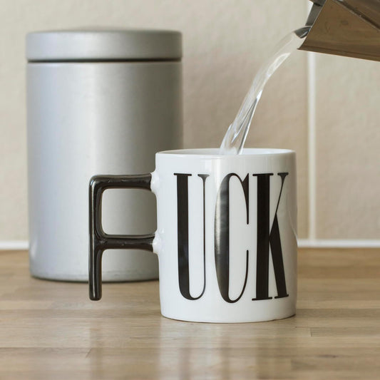Humorous painted pottery mug featuring bold designs ("FUCK" and "DICK"), perfect for adding a playful touch to your daily beverage routine.