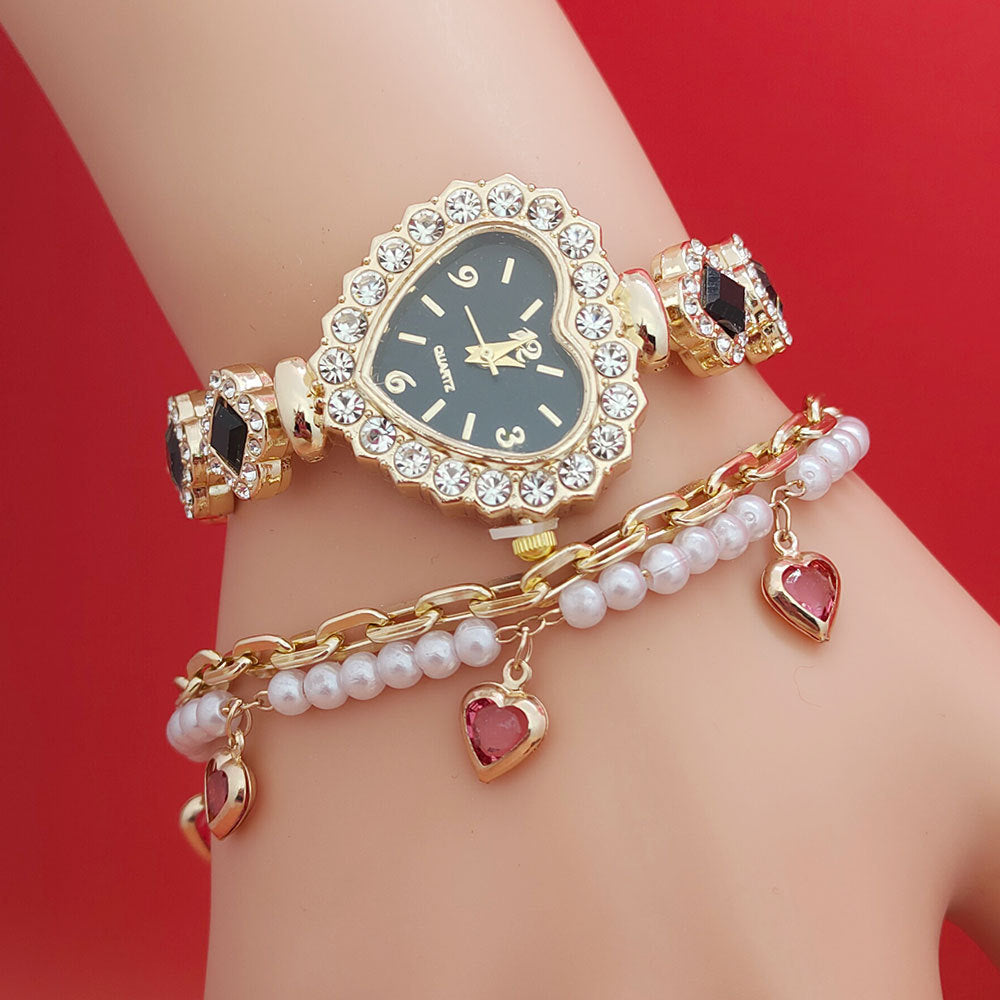 **Love Shape Watch Set – Stylish & Elegant 💖** A **quartz movement** watch with a **unique love shape design**, available in **Red**, **Green**, and **Black**. Featuring **alloy strap** and **stainless steel** watch bottom for durability. A versatile piece, worn as both a **watch** and **bracelet**. ✨