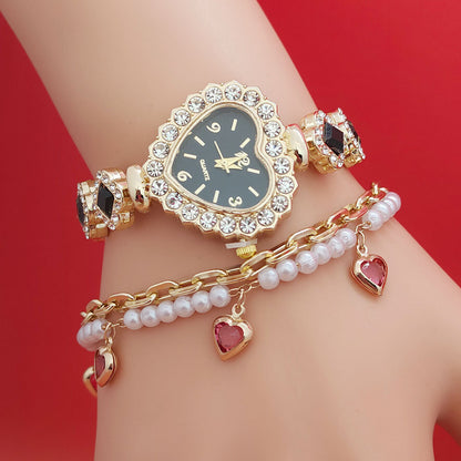 **Love Shape Watch Set – Stylish & Elegant 💖** A **quartz movement** watch with a **unique love shape design**, available in **Red**, **Green**, and **Black**. Featuring **alloy strap** and **stainless steel** watch bottom for durability. A versatile piece, worn as both a **watch** and **bracelet**. ✨