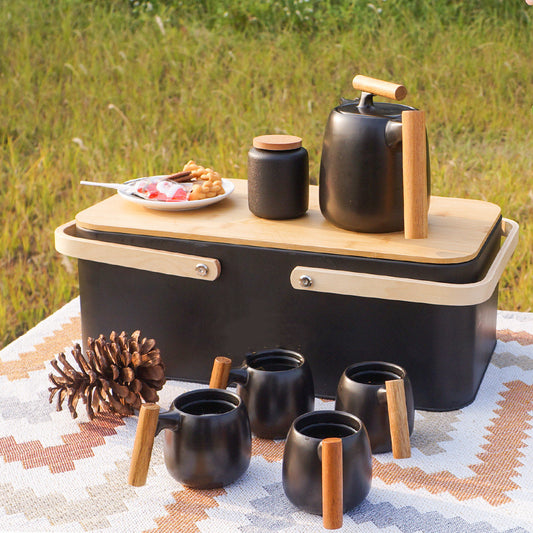 Elegant black porcelain pastoral style portable tea set, featuring an 8-piece set with a small and fresh design, perfect for outdoor tea experiences.