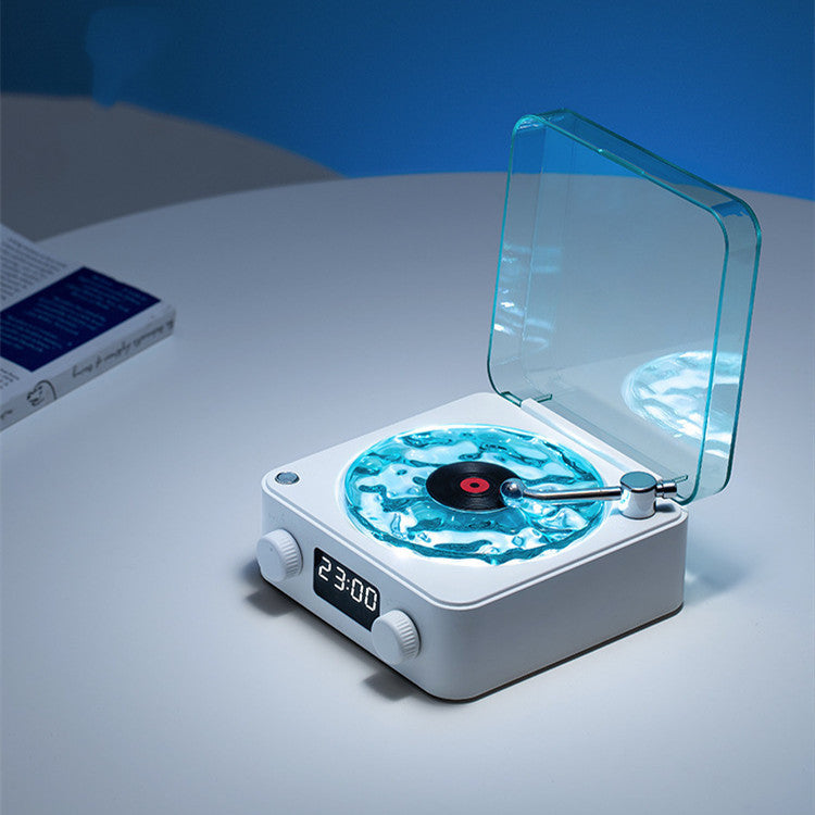 **Retro Turntable Bluetooth Speaker – Vintage Style, Modern Sound 🎶** A portable Bluetooth speaker (142x153x67mm) with a retro design, offering 4 soothing nature sounds like ocean waves and birds. Features 360° surround sound, multiple playback options (Bluetooth, AUX, TF card), and a beautiful breathing light with a transparent turntable. Perfect for parties, relaxation, or enhancing your bedroom ambiance. Available in **blue** and **green**. 🎵