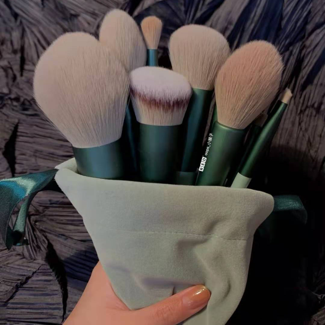A 13-piece makeup brush set featuring soft synthetic bristles, durable plastic handles, and aluminum ferrules. The set includes brushes for foundation, powder, blush, highlighter, eyeshadow, lip, eyebrow, concealer, and blending. Available in various packaging options such as cloth bags and boxes in green, pink, and yellow. Ideal for professional and personal use, providing precise application and easy cleaning.