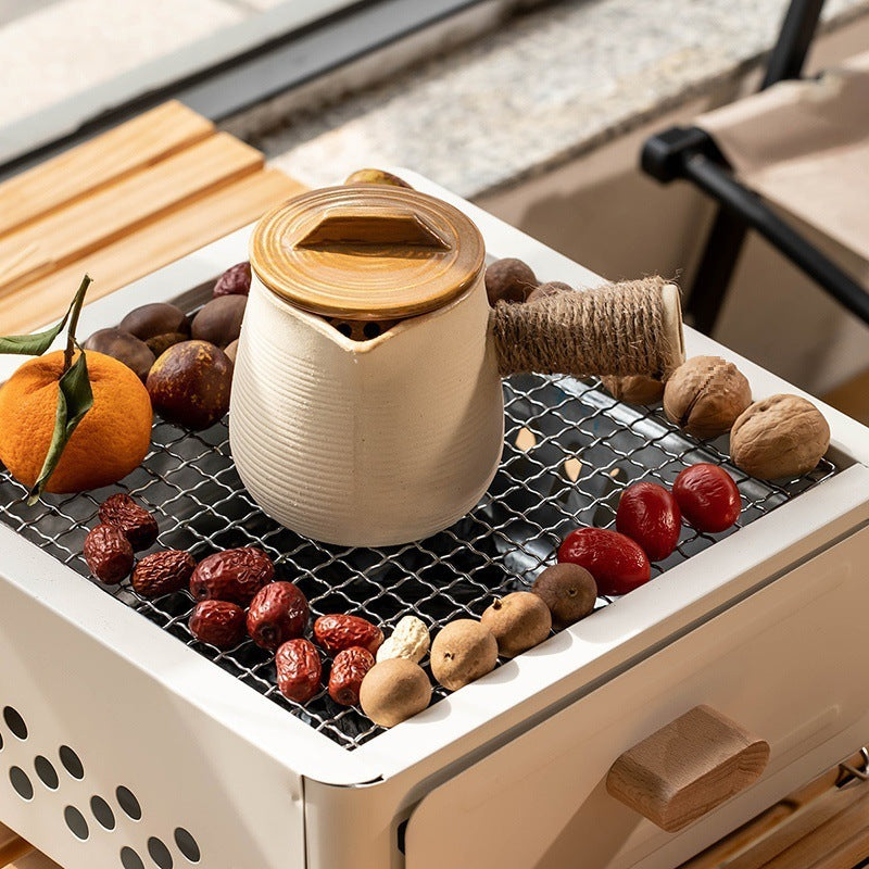 "Square Barbecue Oven-Grill – A white, alloy-constructed grill designed for 3-5 people, featuring a split-type structure, carbon fuel compatibility, and includes a charcoal plate and grill net. Perfect for outdoor gatherings and cookouts."