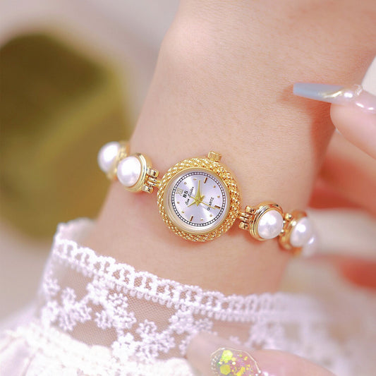 Pearl bracelet women's watch, offering timeless elegance with a fashionable twist for a chic and refined look. #PearlBraceletWatch #TimelessElegance #FashionableTwist #WomensWatch #ChicStyle #LuxuryTimepiece #ElegantAccessories #SophisticatedLook