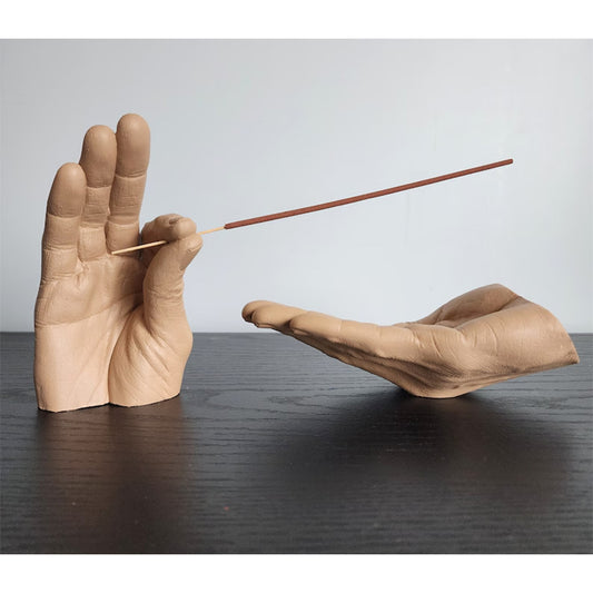 Cartoon-style resin incense holder in the shape of hands, available in black, white, light yellow, and brown. Made from synthetic resin, with a size of 19 * 10 * 10 cm, perfect for holding and receiving incense.