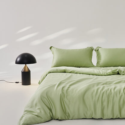 Luxuriously soft Four-Piece Ice Silk Bed Sheets made from breathable Lyocell fiber (Tencel). Features a modern minimalist design, reactive dyeing for long-lasting color, and a silky-smooth texture for year-round comfort. Available in multiple sizes.