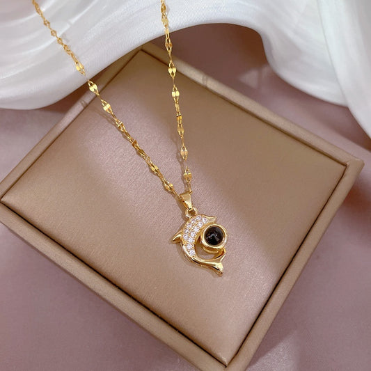 Exquisite dolphin stone necklace, featuring a unique and elegant design. Perfect for adding exotic charm to any outfit.