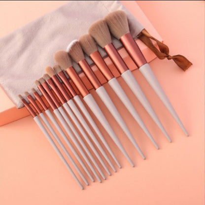 A 13-piece makeup brush set featuring soft synthetic bristles, durable plastic handles, and aluminum ferrules. The set includes brushes for foundation, powder, blush, highlighter, eyeshadow, lip, eyebrow, concealer, and blending. Available in various packaging options such as cloth bags and boxes in green, pink, and yellow. Ideal for professional and personal use, providing precise application and easy cleaning.