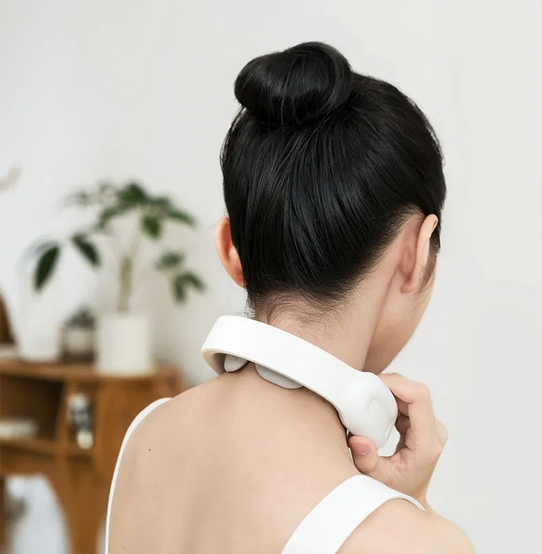"Multifunctional Remote Control Neck Massager – A USB-powered neck massager with low-cycle pulse technology for deep pain relief. Includes remote control for easy mode adjustments, available in pink, black, and blue. Perfect for neck and shoulder tension relief."