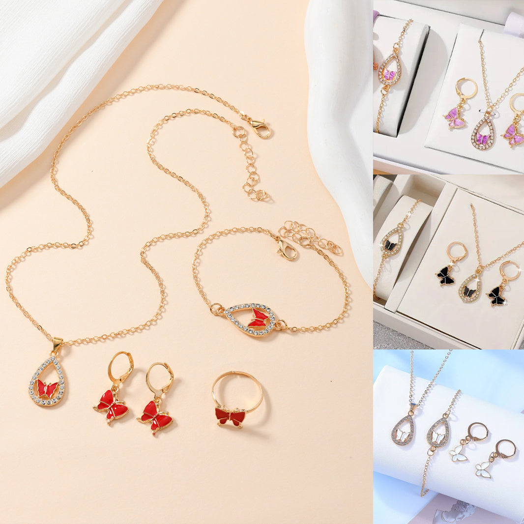 Elegant Butterfly Jewelry Set featuring a necklace, earrings, bracelet, and ring in electroplated alloy, available in red, pink, white, and black.