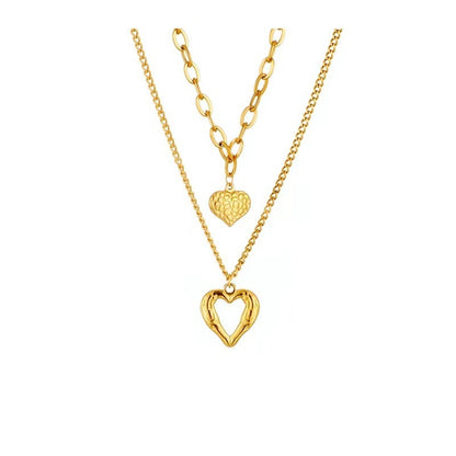 **Love Necklace Gift Set – Stylish & Elegant**  

A beautiful **2-piece necklace set** featuring **heart-shaped** and **geometric pendants** made from **high-quality titanium steel**. Available in **silver** and **golden** colors, with **gold inlaid treatment** for a luxurious finish. The **O-shaped chain** adds comfort and style, perfect for women who love elegant, **Korean-style** accessories.