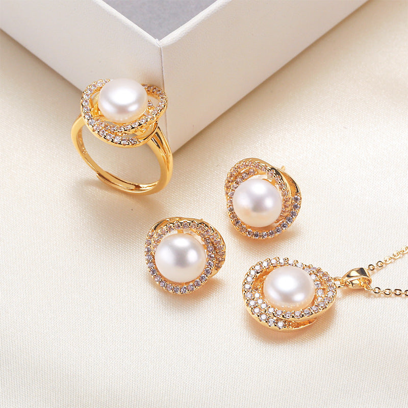 Elegant pearl necklace, ring, and earrings set in various color options, featuring timeless designs and luxurious craftsmanship