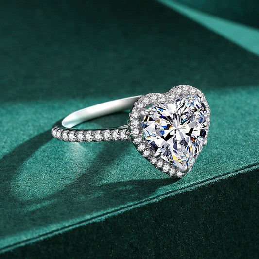 Elegant heart-shaped silver ring with inlaid zircon, featuring a luxurious design. Available in multiple sizes, perfect for women who love timeless and romantic jewelry.