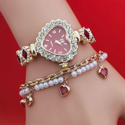 **Love Shape Watch Set – Stylish & Elegant 💖** A **quartz movement** watch with a **unique love shape design**, available in **Red**, **Green**, and **Black**. Featuring **alloy strap** and **stainless steel** watch bottom for durability. A versatile piece, worn as both a **watch** and **bracelet**. ✨