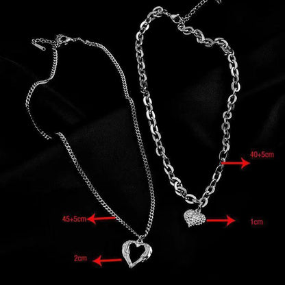 **Love Necklace Gift Set – Stylish & Elegant**  

A beautiful **2-piece necklace set** featuring **heart-shaped** and **geometric pendants** made from **high-quality titanium steel**. Available in **silver** and **golden** colors, with **gold inlaid treatment** for a luxurious finish. The **O-shaped chain** adds comfort and style, perfect for women who love elegant, **Korean-style** accessories.