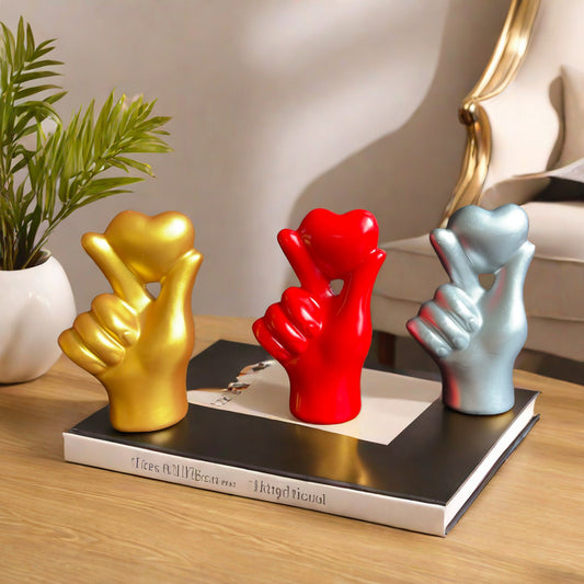 **Love Gesture Resin Ornament** – A beautifully crafted **resin decor piece** symbolizing love and warmth. Available in **red, gold, silver, and white**, it’s compact (**11 × 6.5 × 4 cm**) and perfect for any space. Ideal as a **gift or home accent**. 💖