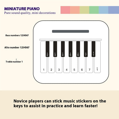  Mini retro-style piano toy in white or black, featuring 24 brief piano scores of world-famous pieces. Packaged in a gift box, perfect as a musical gift or decorative piece.