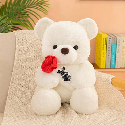 Teddy Bear with Rose – Soft plush bear with a rose, available in white, pink, brown, and gray, perfect for gifting on special occasions. Made with PP cotton and rabbit plush.
