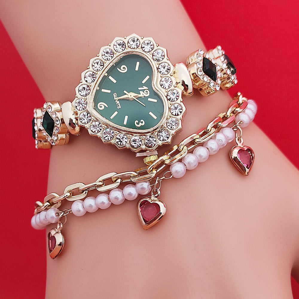 **Love Shape Watch Set – Stylish & Elegant 💖** A **quartz movement** watch with a **unique love shape design**, available in **Red**, **Green**, and **Black**. Featuring **alloy strap** and **stainless steel** watch bottom for durability. A versatile piece, worn as both a **watch** and **bracelet**. ✨