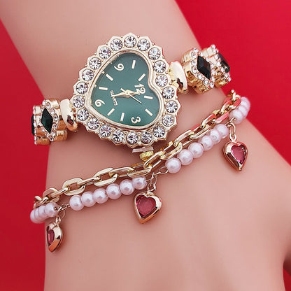 **Love Shape Watch Set – Stylish & Elegant 💖** A **quartz movement** watch with a **unique love shape design**, available in **Red**, **Green**, and **Black**. Featuring **alloy strap** and **stainless steel** watch bottom for durability. A versatile piece, worn as both a **watch** and **bracelet**. ✨