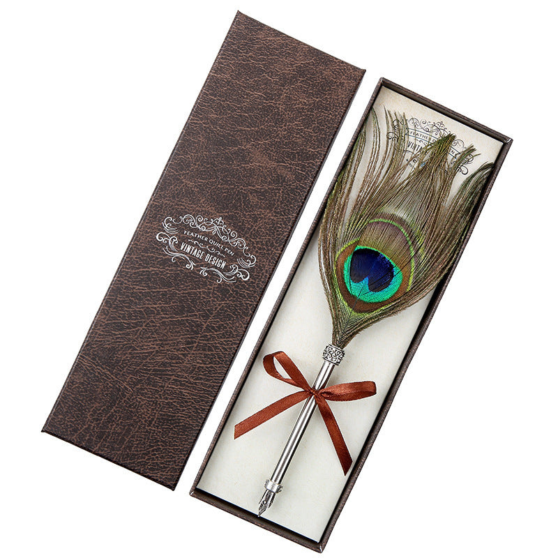 **Elegant Retro Feather Pen Gift Set – Vintage Writing Experience**  

A beautifully crafted **stainless steel feather pen** set in a stylish **gift box**, perfect for writers, calligraphy enthusiasts, and collectors. Timeless design meets smooth writing for an unforgettable experience. Ideal for gifting on any occasion! 🎁✒️