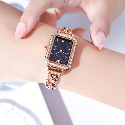 Luxury ladies watch featuring a sleek square dial with a choice of red, gold plate, starry sky black, or small green color options. The 8mm thick watch boasts a mineral reinforced glass mirror, a jewelry buckle, and a stainless steel back for durability and style.