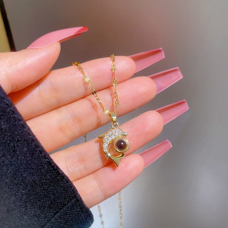Exquisite dolphin stone necklace, featuring a unique and elegant design. Perfect for adding exotic charm to any outfit.