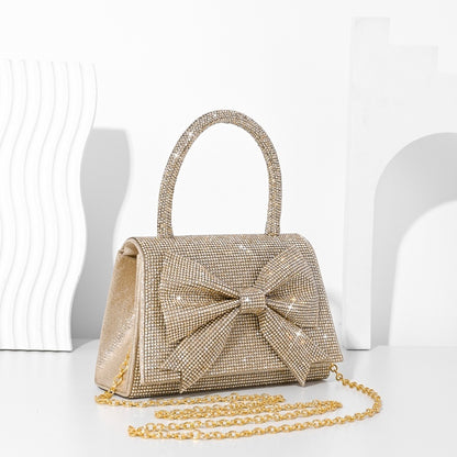 Step into the world of luxury and sophistication with the Elegant Full-Diamond Bow Handbag, a true statement piece that combines timeless elegance with a modern edge. Designed for the fashion-forward, this handbag is a stunning blend of street trend and light luxury style.