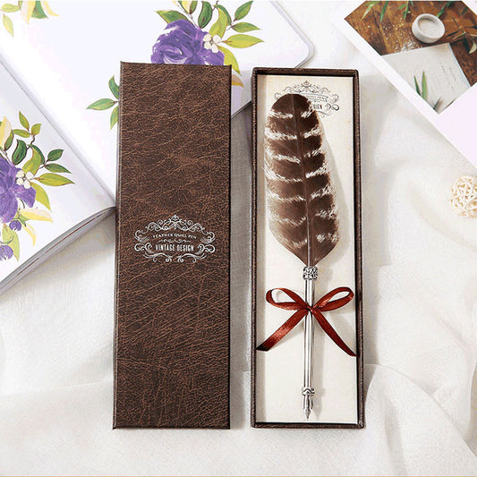 **Elegant Retro Feather Pen Gift Set – Vintage Writing Experience**  

A beautifully crafted **stainless steel feather pen** set in a stylish **gift box**, perfect for writers, calligraphy enthusiasts, and collectors. Timeless design meets smooth writing for an unforgettable experience. Ideal for gifting on any occasion! 🎁✒️