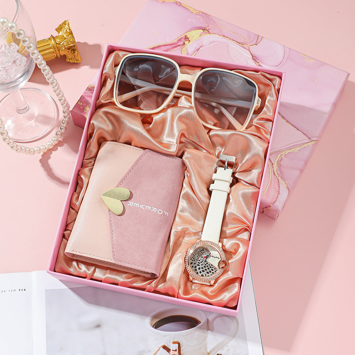 Elegant Women's Watch Business Gift Set featuring a sleek, fashion-forward design. This quartz movement timepiece is adorned with a stylish pointer and number display. The 35mm round dial with a spiral crown ensures precision, while the stainless steel needle buckle offers durability. The set includes a watch, glasses, wallet, and an elegant packaging box, making it a perfect gift choice. Available in square steel belt, pink belt, or white belt styles, this set is designed to impress, ideal for both busines
