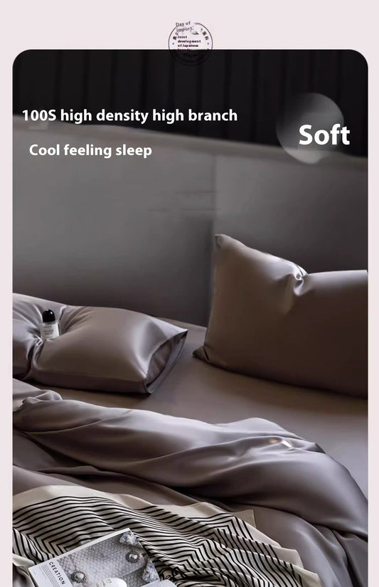 Luxuriously soft Four-Piece Ice Silk Bed Sheets made from breathable Lyocell fiber (Tencel). Features a modern minimalist design, reactive dyeing for long-lasting color, and a silky-smooth texture for year-round comfort. Available in multiple sizes.