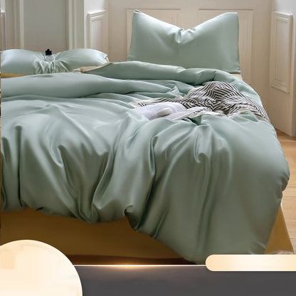 Luxuriously soft Four-Piece Ice Silk Bed Sheets made from breathable Lyocell fiber (Tencel). Features a modern minimalist design, reactive dyeing for long-lasting color, and a silky-smooth texture for year-round comfort. Available in multiple sizes.