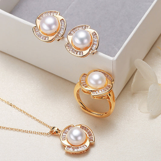 Elegant pearl necklace, ring, and earrings set in various color options, featuring timeless designs and luxurious craftsmanship